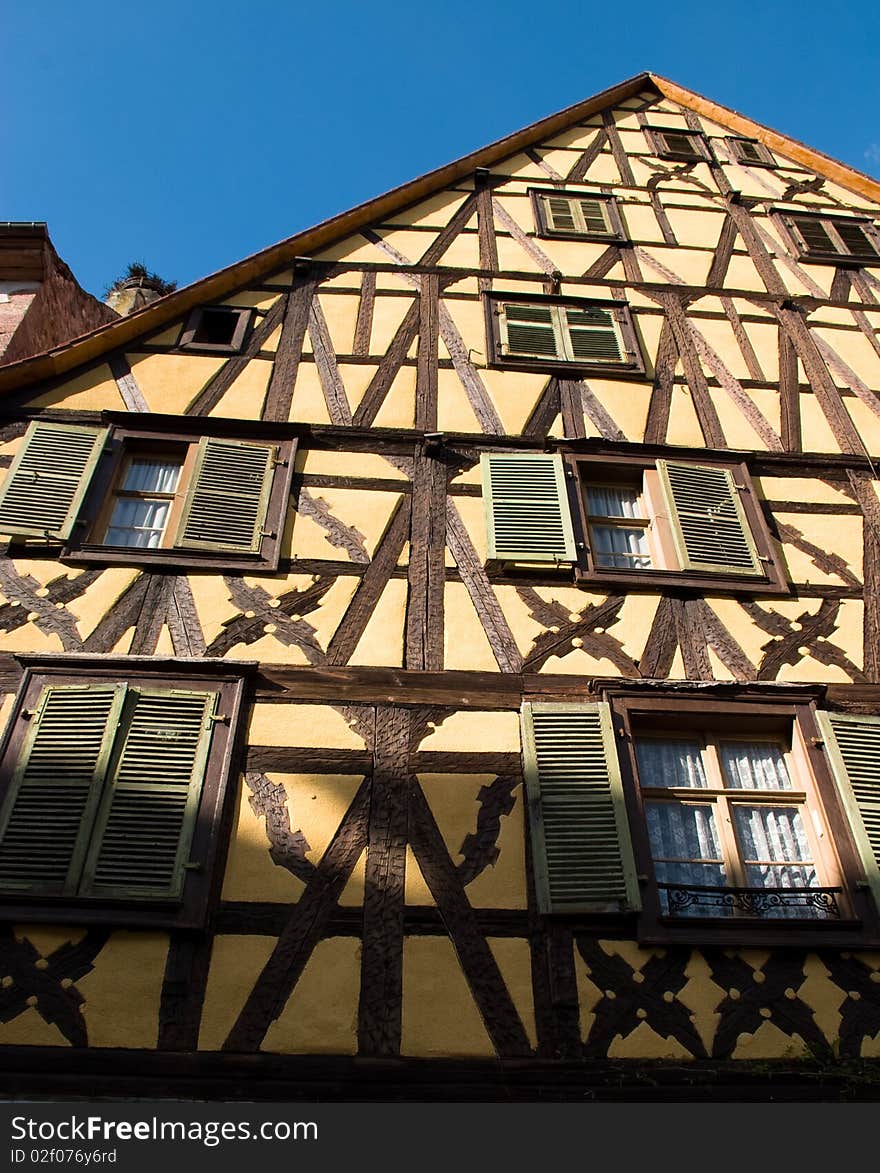 Traditional timber frame and stucco house in Riquewihr, , Alsace, France. Traditional timber frame and stucco house in Riquewihr, , Alsace, France