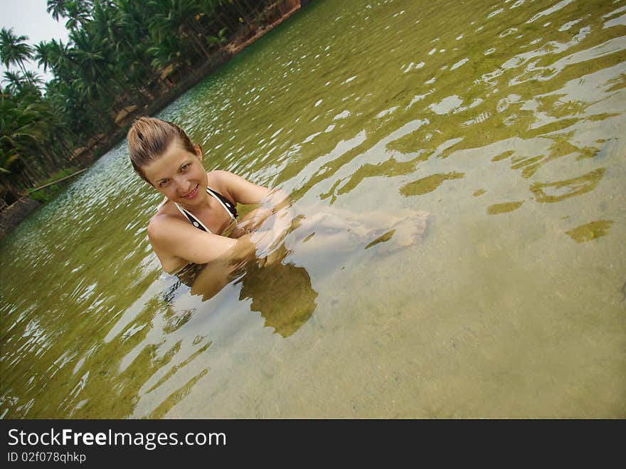 Attractive Woman In Tropical River