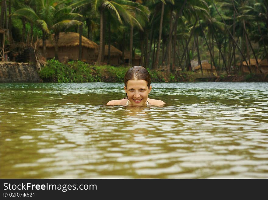 Attractive Woman In Tropical River