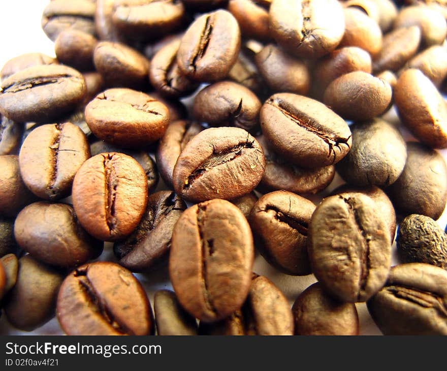 An aromatic roasted coffee beans background. An aromatic roasted coffee beans background.