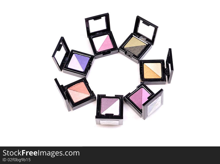 Eye shadow compact case in circular form.