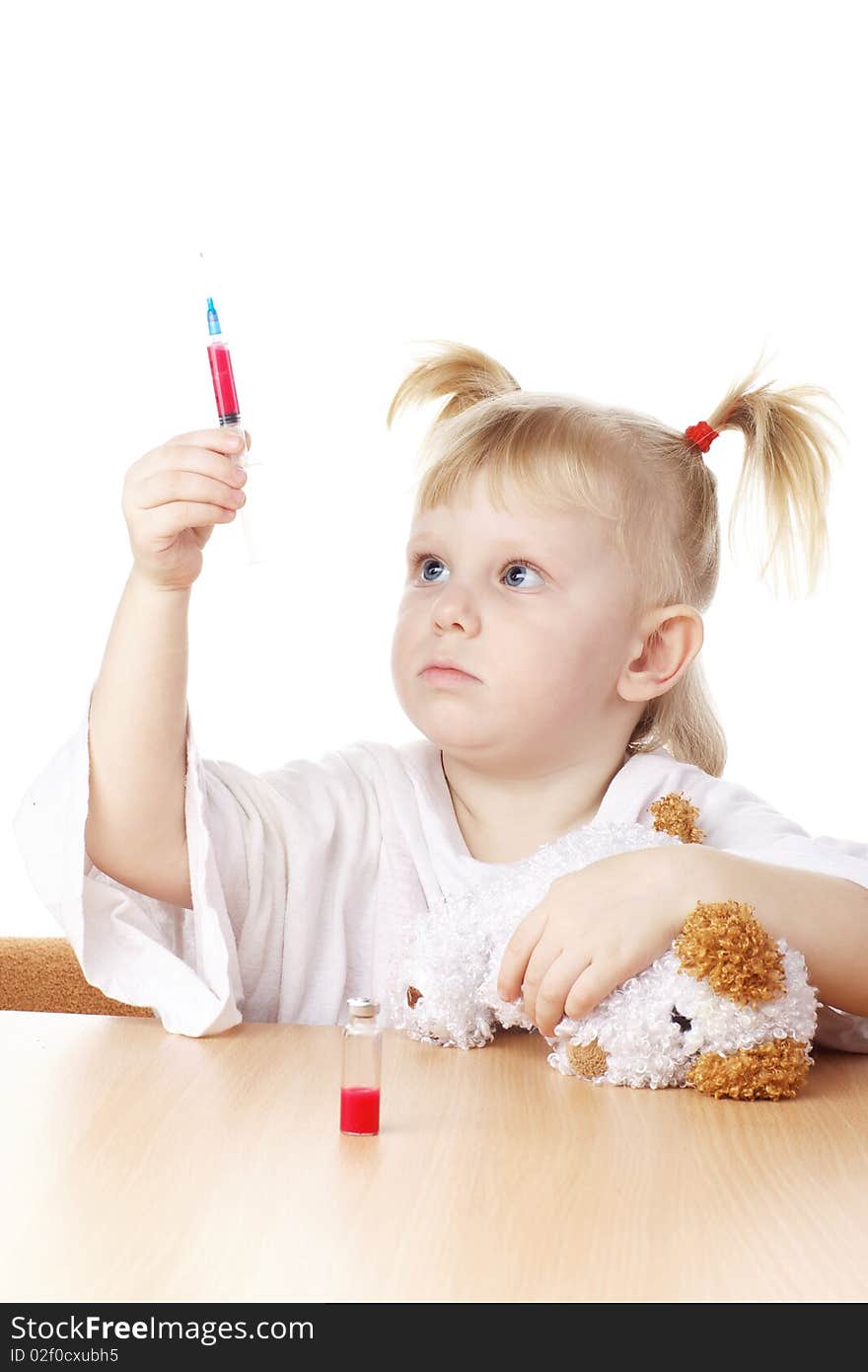 Child playing as a doctor with syringe