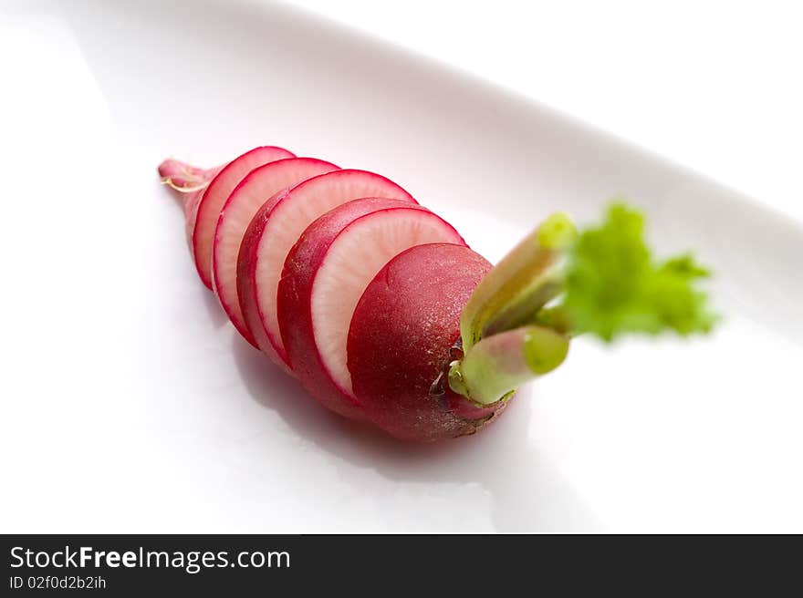 Sliced red radish on white background