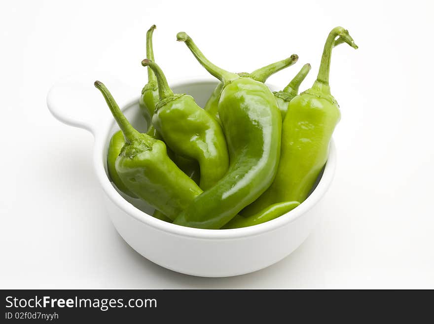 Green peppers in a white bowl. Green peppers in a white bowl