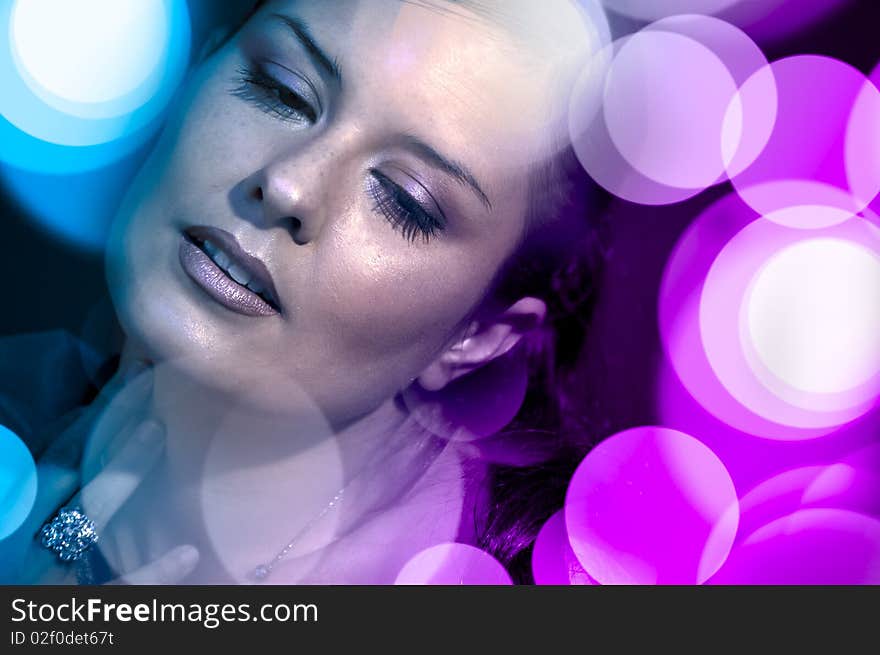 Beautiful woman with disco lights