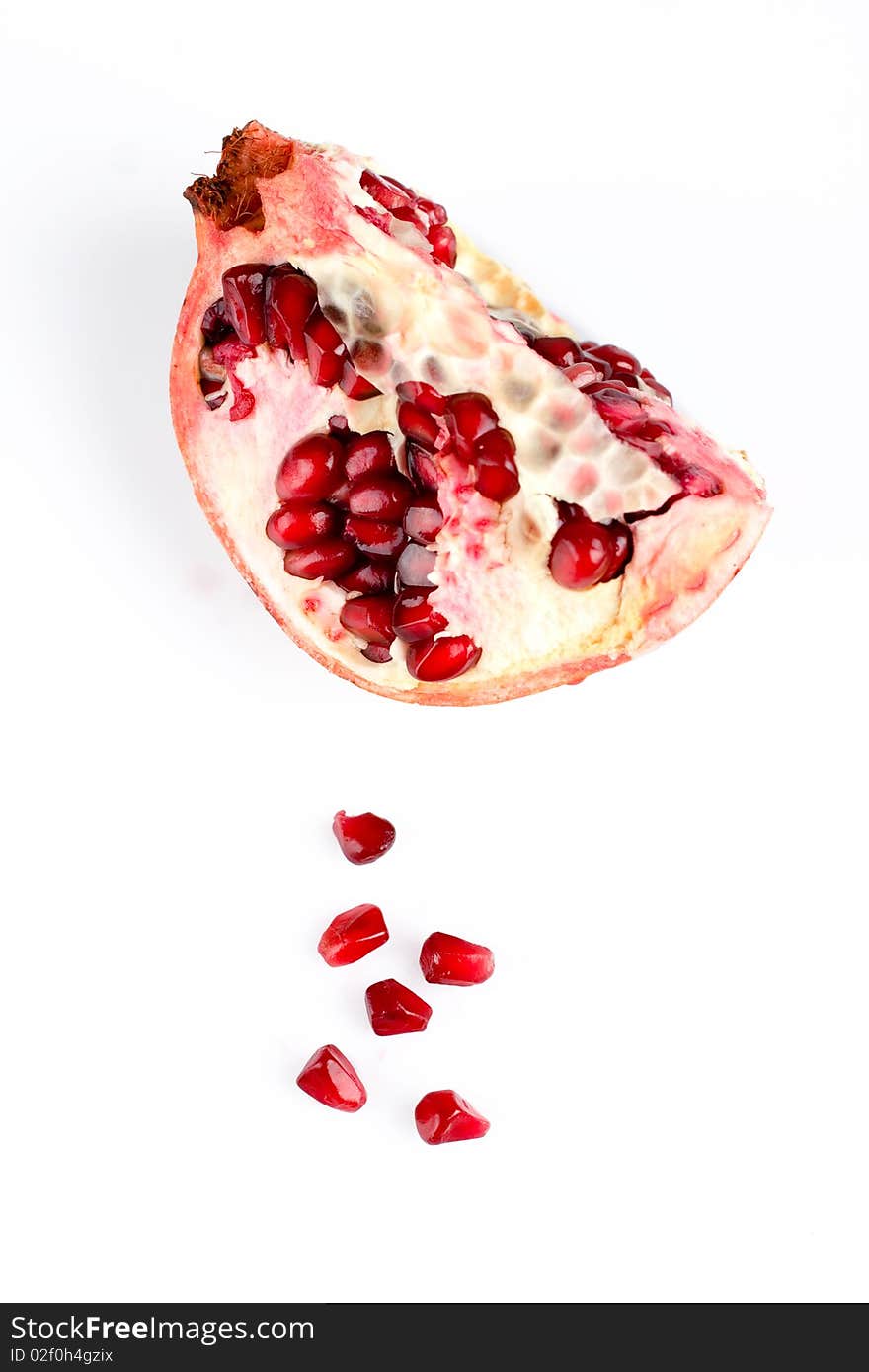 Piece of pomegranate isolated on the white