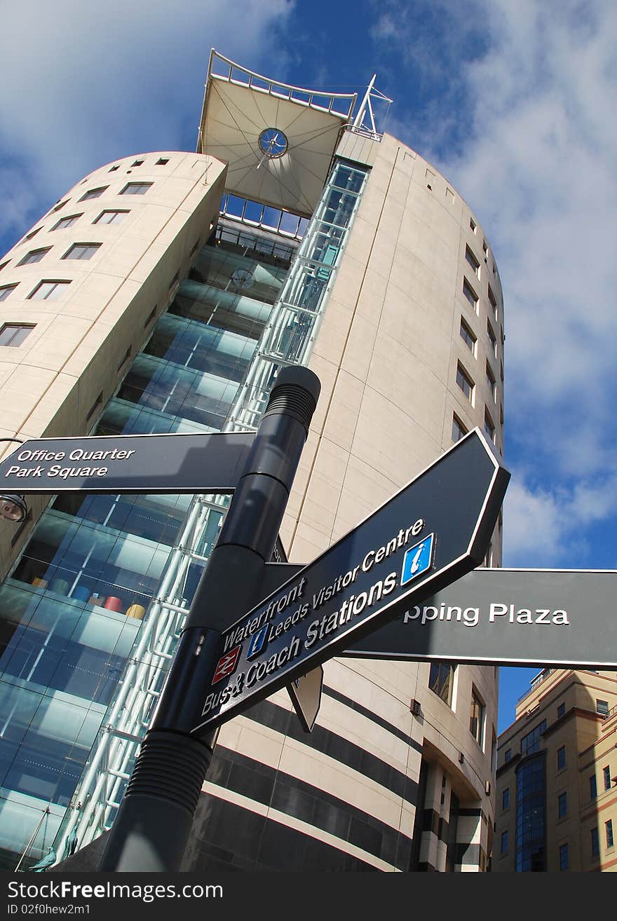 Sign post outside on modern building in city center. Sign post outside on modern building in city center