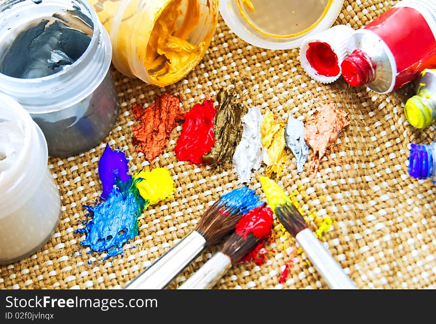 Close up of paint and paint brushes