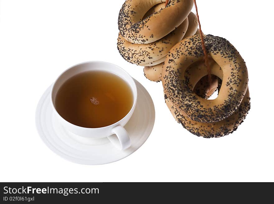 Cup of tea and bagels isolated on white background