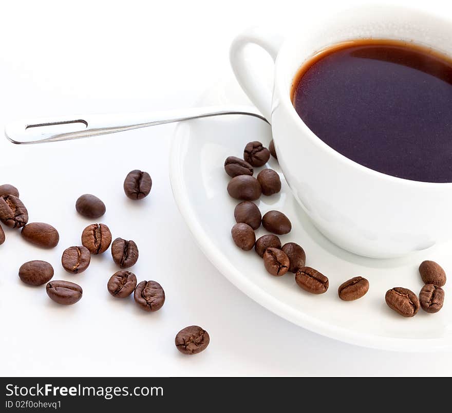 Coffee and coffee beans on white background