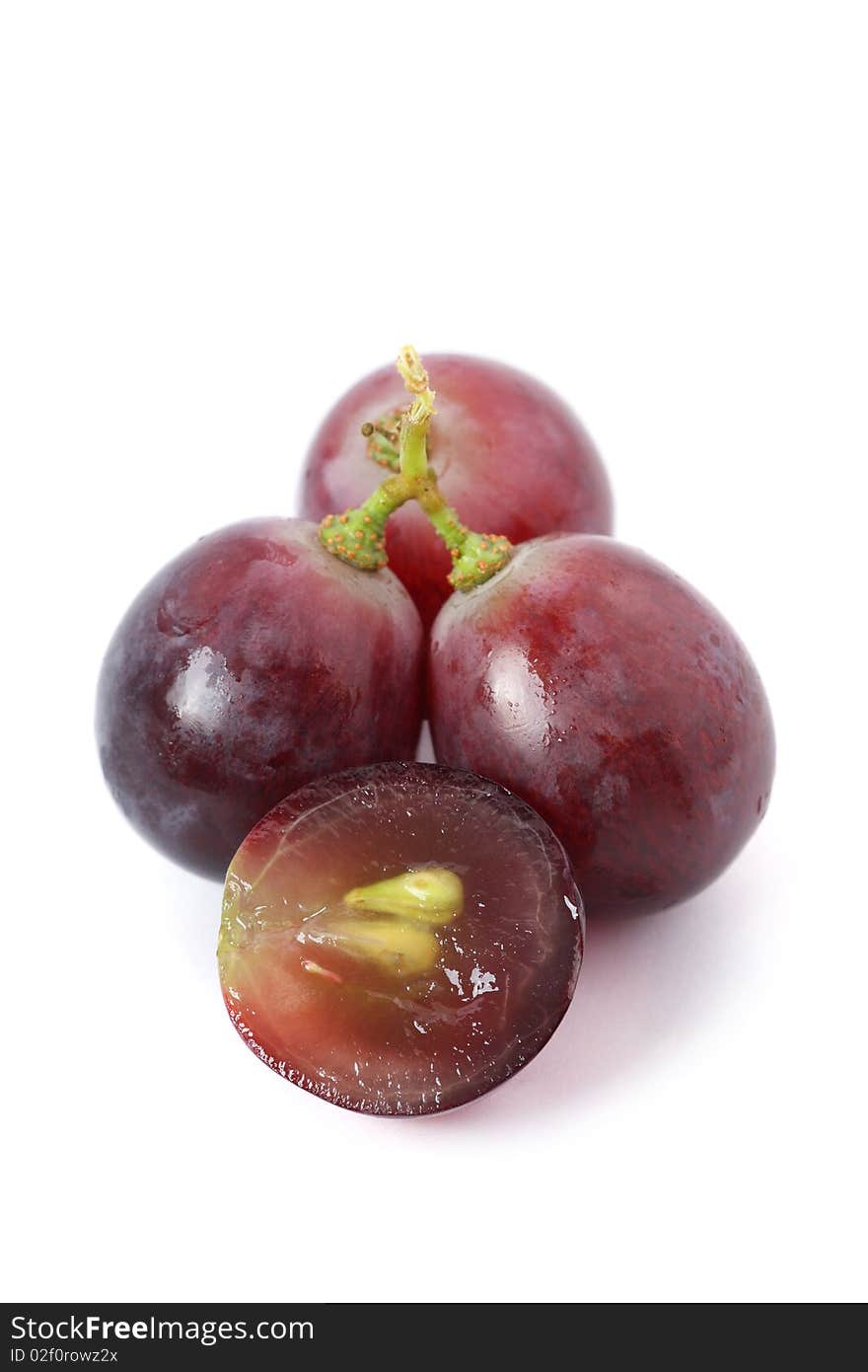 A string of grapes isolated on white background. A string of grapes isolated on white background.