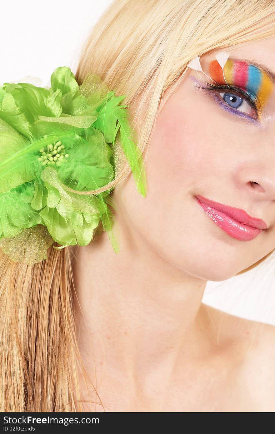 Portrait of a beautiful blonde woman with light blue eyes and colorful make-up on white background. Portrait of a beautiful blonde woman with light blue eyes and colorful make-up on white background