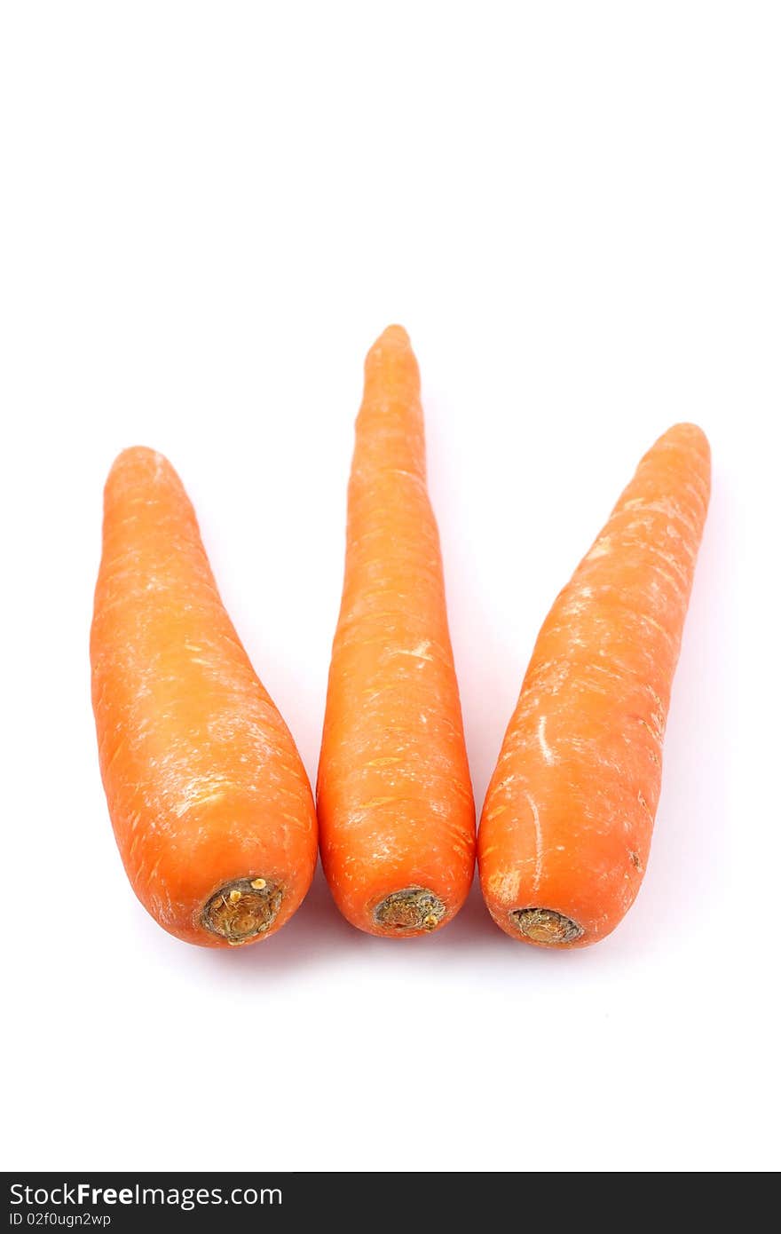 Three orange carrots isolated on white background.