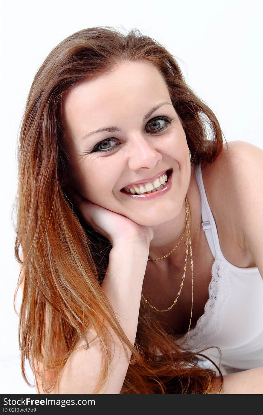 Lying and smiling attractive woman on white background