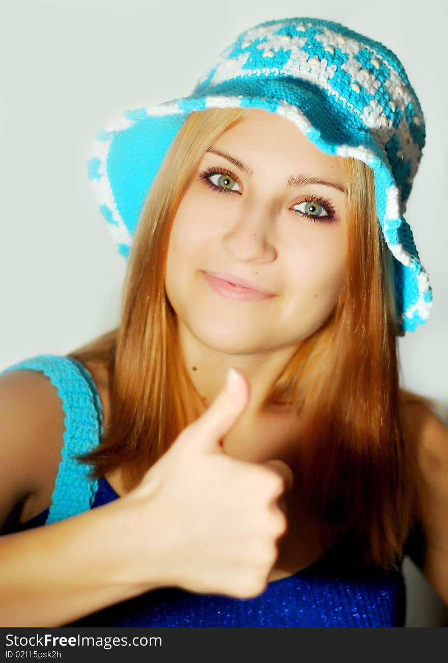 The girl with a hat on a white background