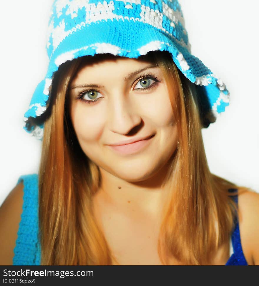 The girl with a hat on a white background