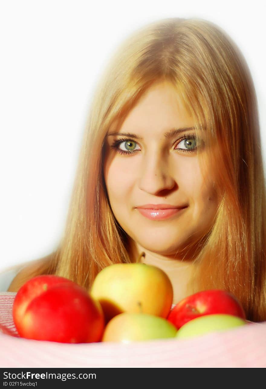 The girl with apples on a white background