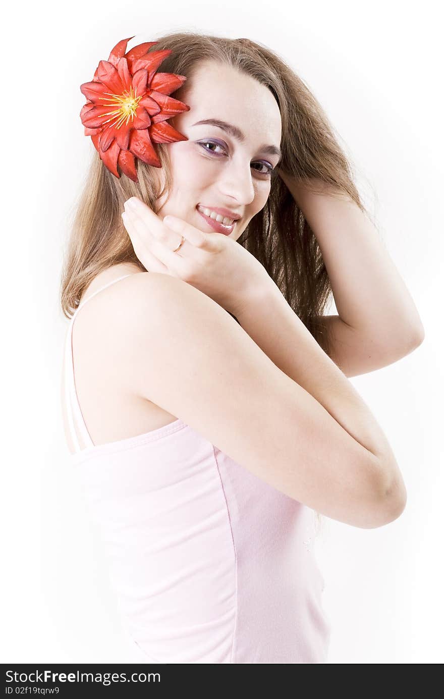 Studio portrait of a beautiful girl with flowers