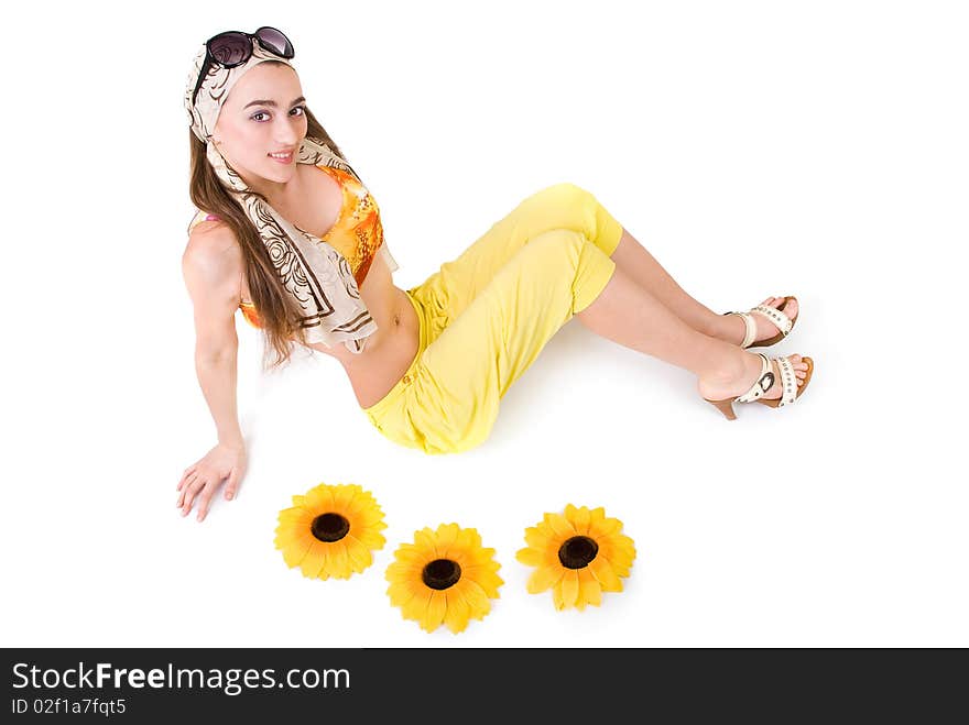 Studio portrait of a beautiful girl with flowers