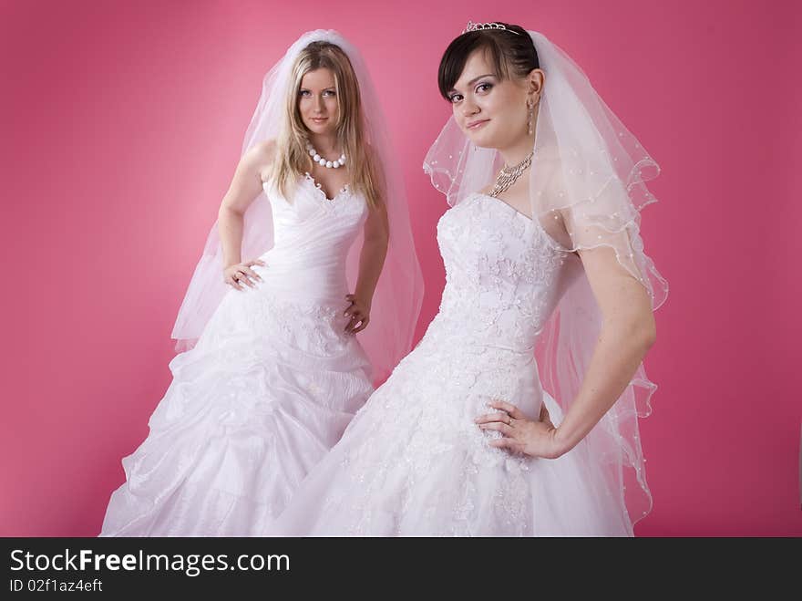 Two happy bride on pink. Two happy bride on pink