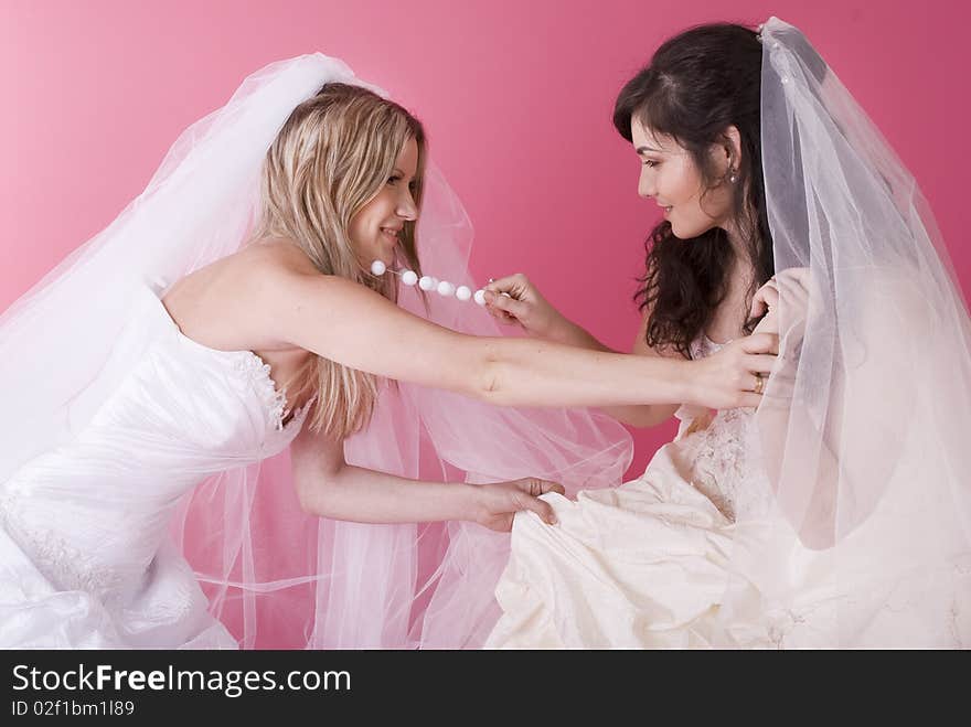 Two brides fight and shout at each other. Two brides fight and shout at each other