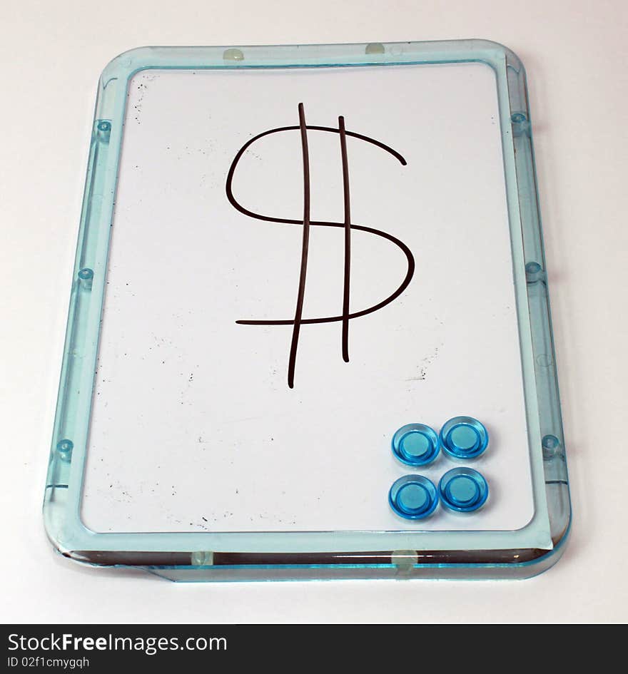 A dollar sign on a whiteboard