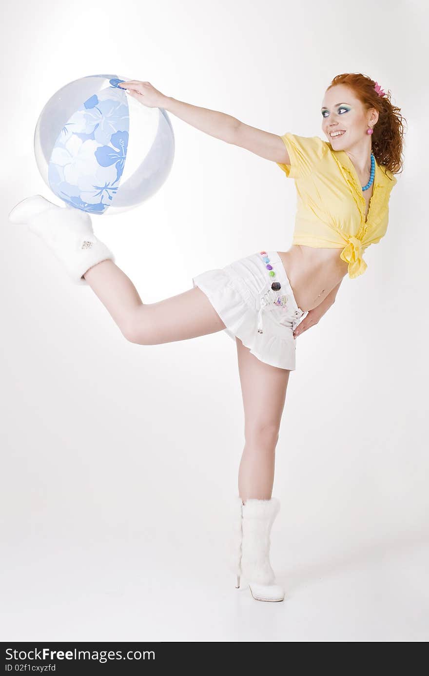 red-haired girl with bright make-up on a white studio background. red-haired girl with bright make-up on a white studio background