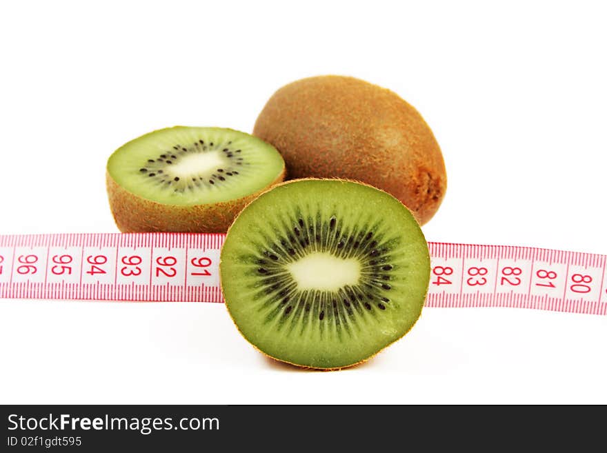 Juicy fresh kiwi fruit with tape measure isolated on white background. Juicy fresh kiwi fruit with tape measure isolated on white background