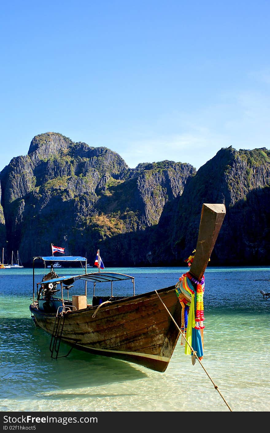 A longboat docked perfectly upon the beautiful backdrop. A longboat docked perfectly upon the beautiful backdrop.