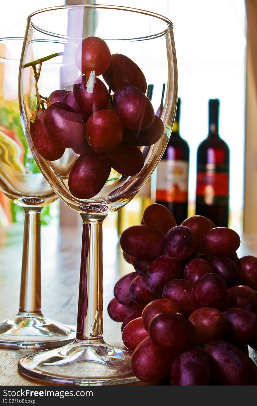 Red grapes in a glass wine concept image. Red grapes in a glass wine concept image