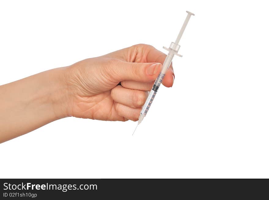 Syringe in the woman's hand for making injections