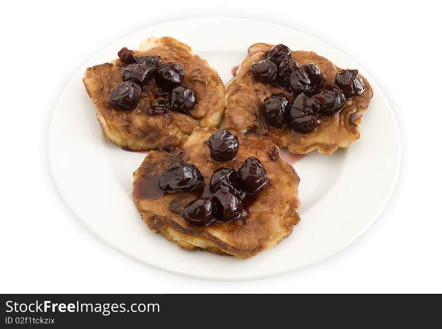 Pancakes with jam on a plate on a white background