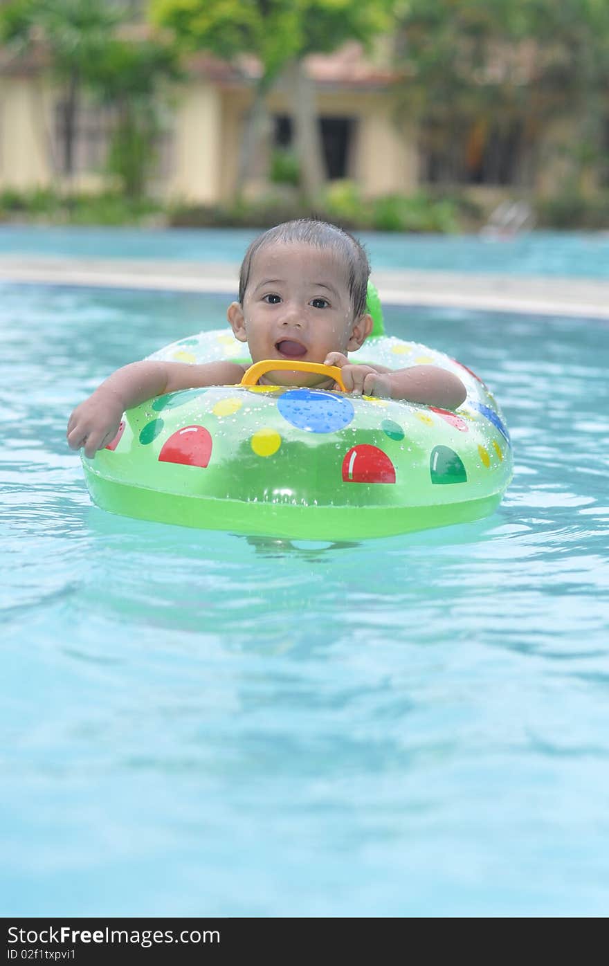 Cute baby in swimming pool