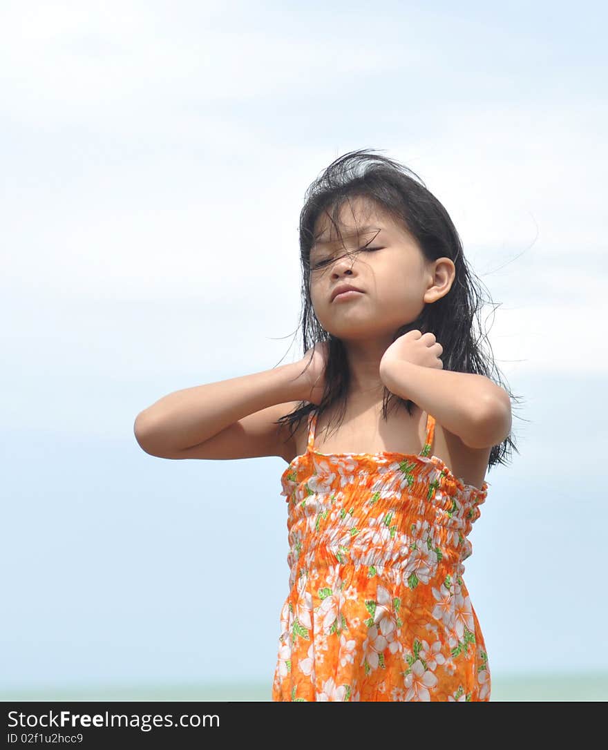 Little girl on a beautiful day at the beach