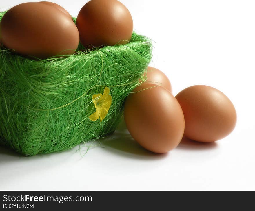 Eggs in and out of green basket