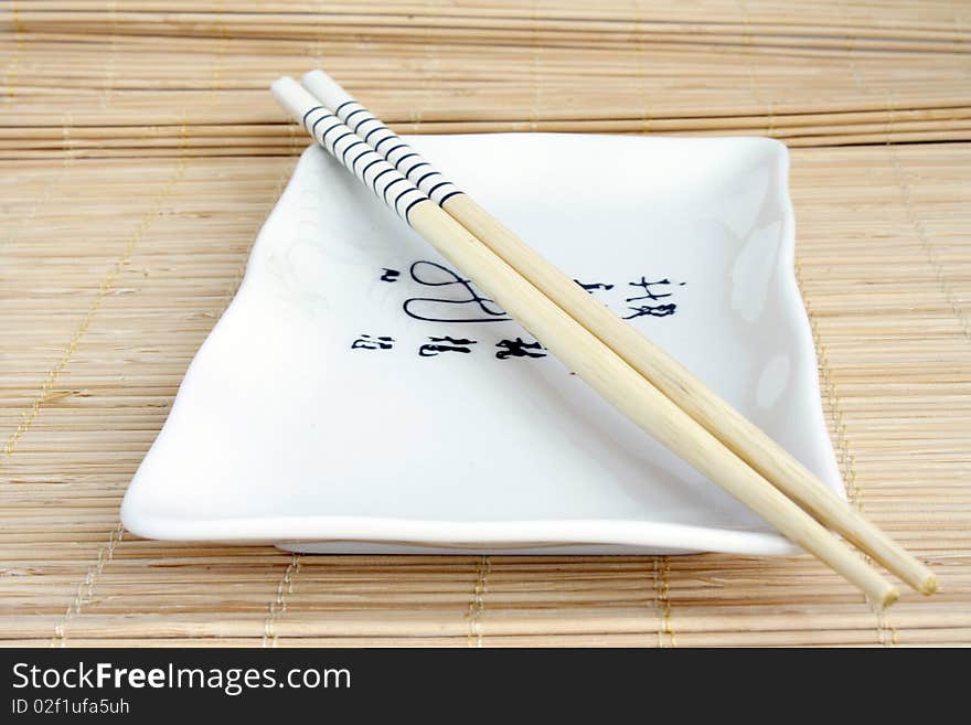 Chinese crockery set on mat. Chinese crockery set on mat