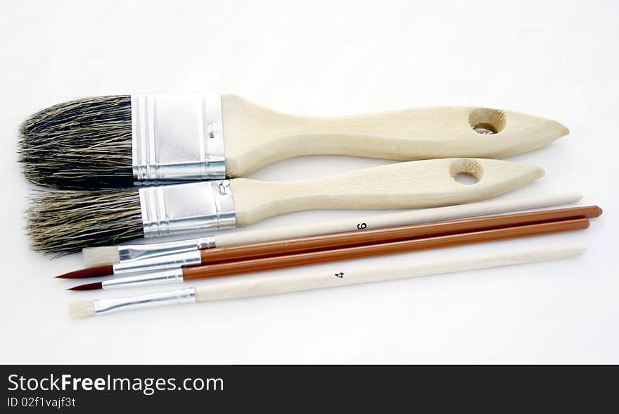 Brushes of different sizes on the white background