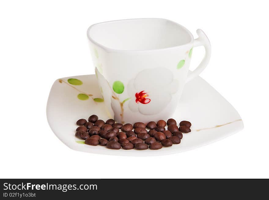 White cup with coffee beans.