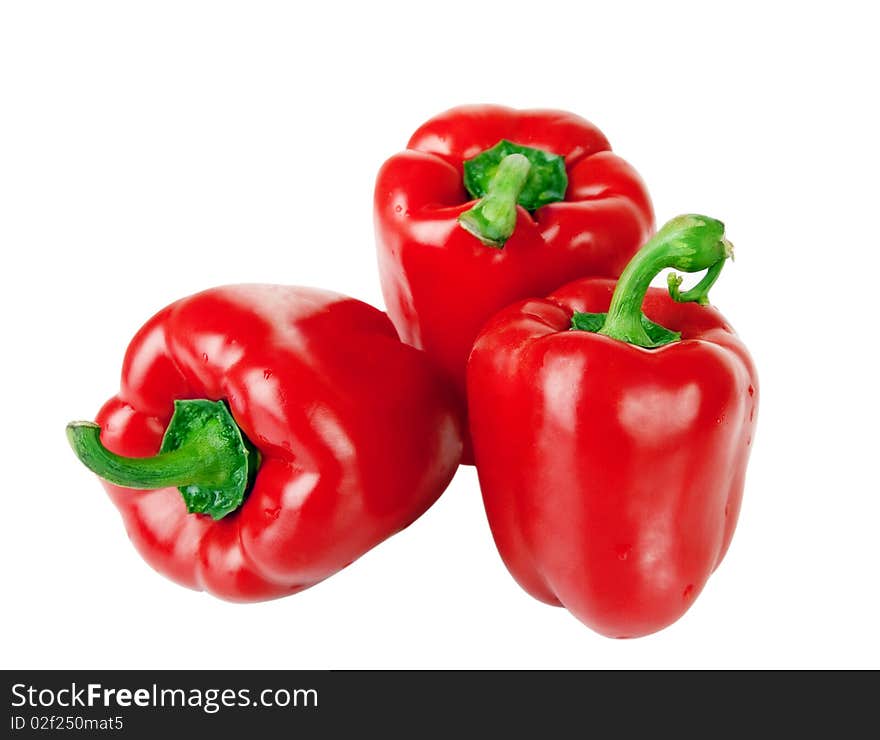 Three red peppers isolated on white background.