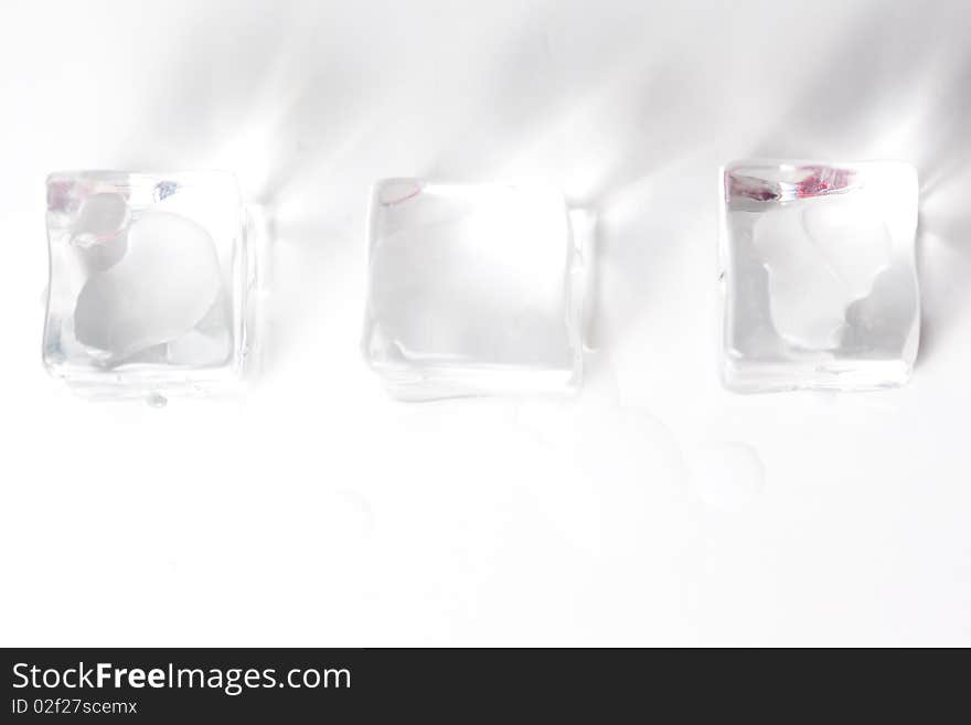 Translucent ice cube isolated over white background