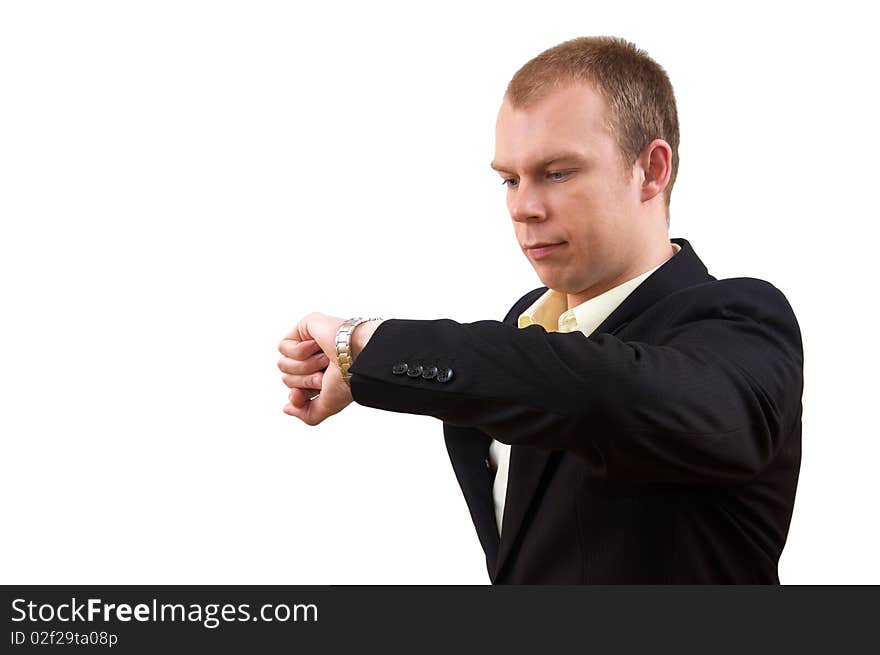 Young businessman in suit looking at watch, on white background. Young businessman in suit looking at watch, on white background