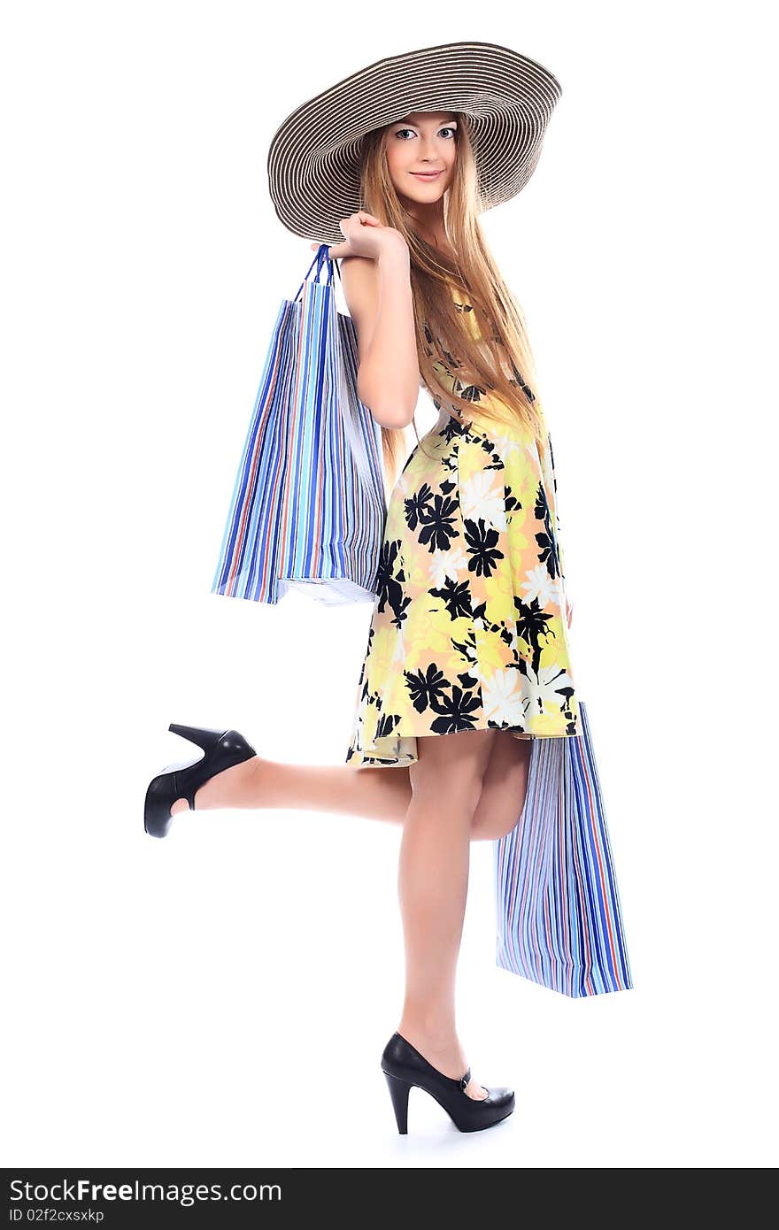 Pretty girl with shopping bags. Isolated over white background. Pretty girl with shopping bags. Isolated over white background.