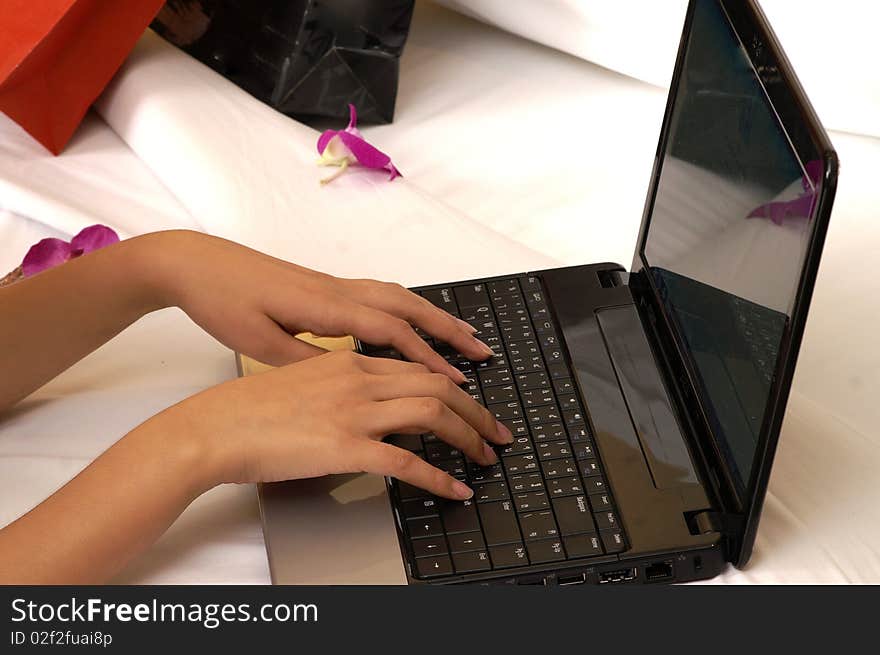 Hands using laptop shopping