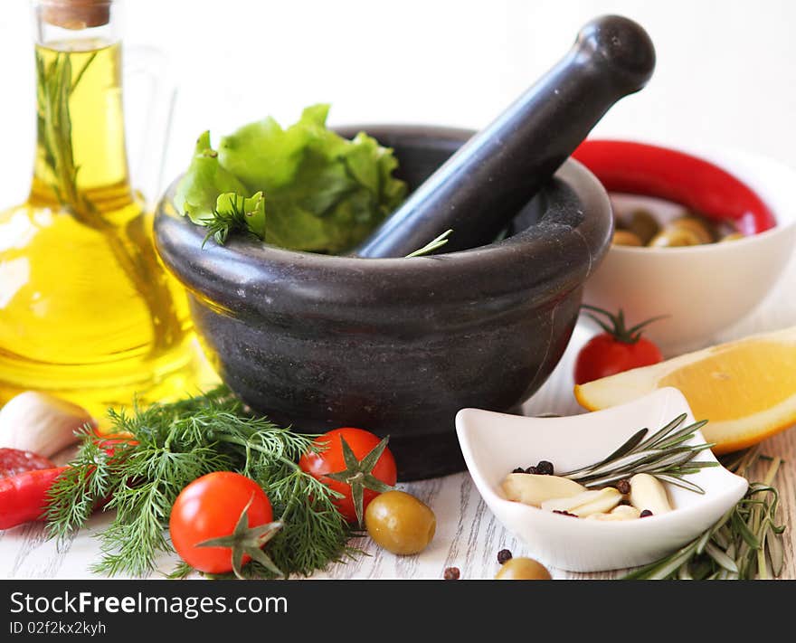 Still life with olive oil and vegetables