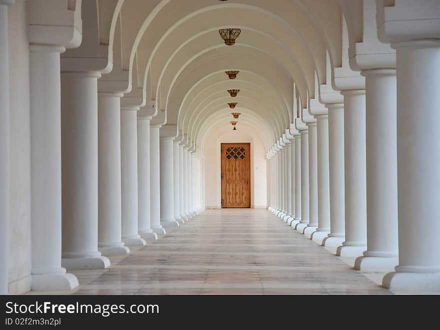 A row of white columns in a romanian monastery. A row of white columns in a romanian monastery