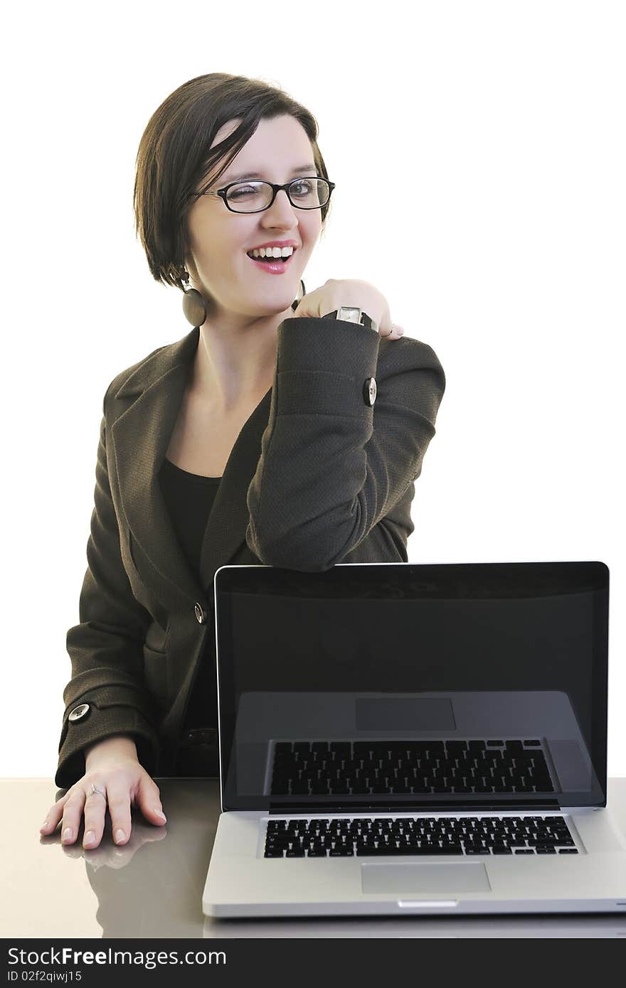 One young business woman isolated on white working on laptop computer. One young business woman isolated on white working on laptop computer