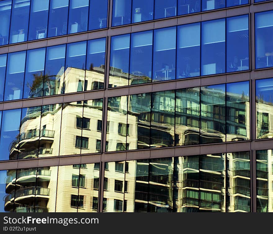 Reflection of apartments in office building