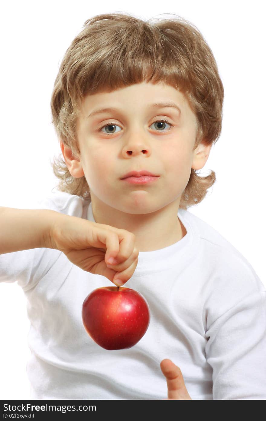 Little beautiful child playing and eating an apple - isolated on white. Little beautiful child playing and eating an apple - isolated on white