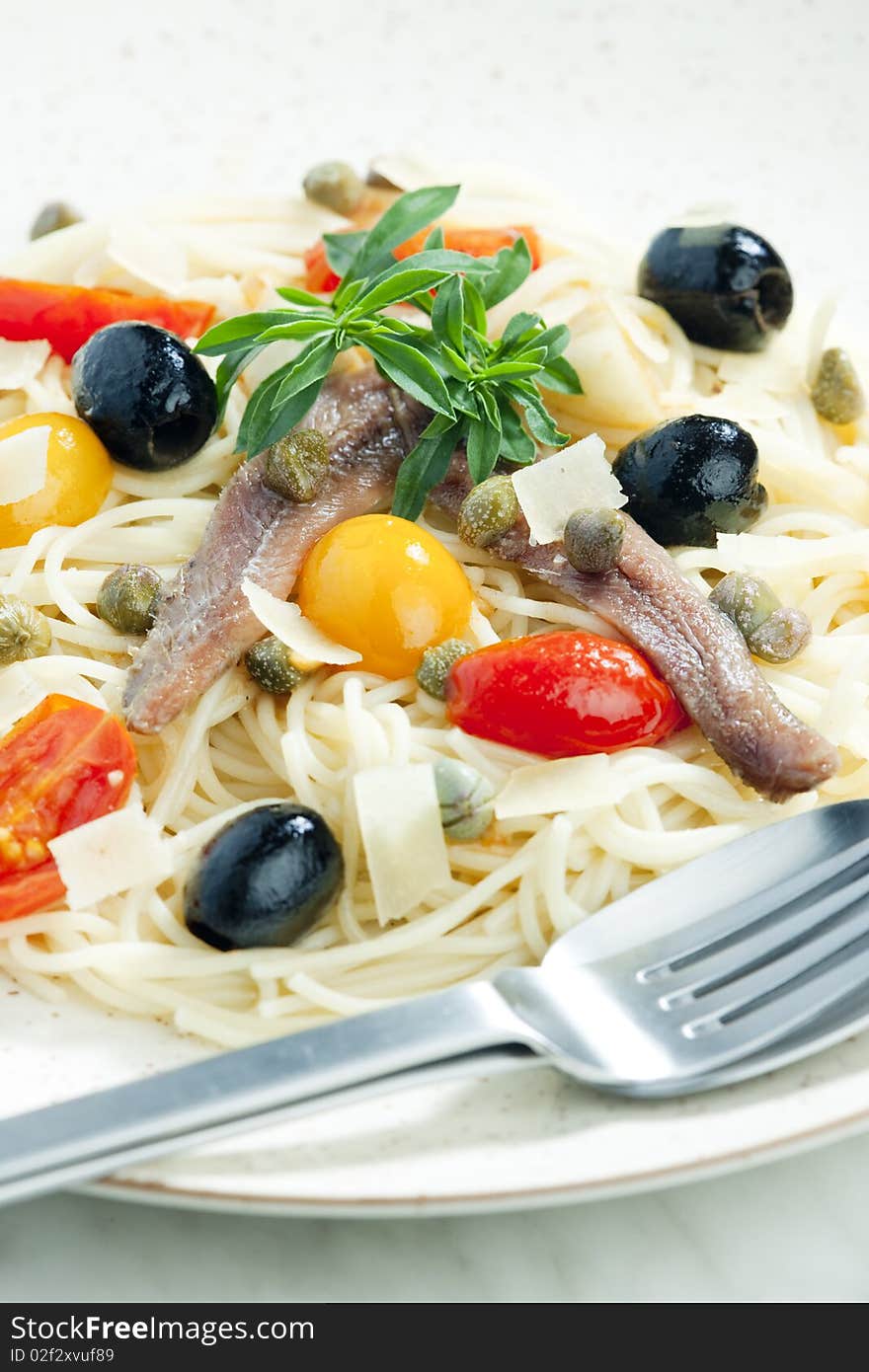 Pasta with anchovies, capers and olives