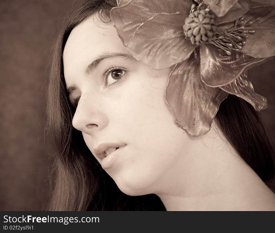 Portrait of a Girl with a Large Flower in Ear. Portrait of a Girl with a Large Flower in Ear